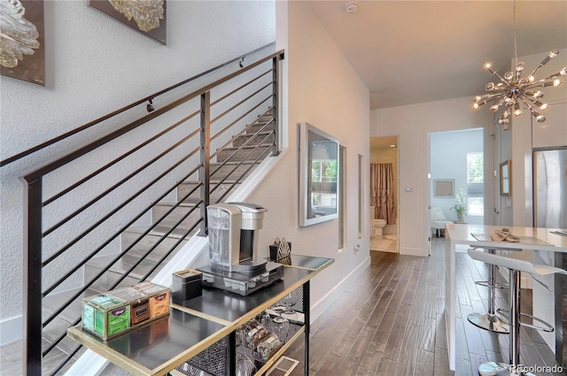 3030 Wilson Ct Unit 5, Denver, CO 80205 - hallway featuring a chandelier, dark wood-style flooring, and stairway