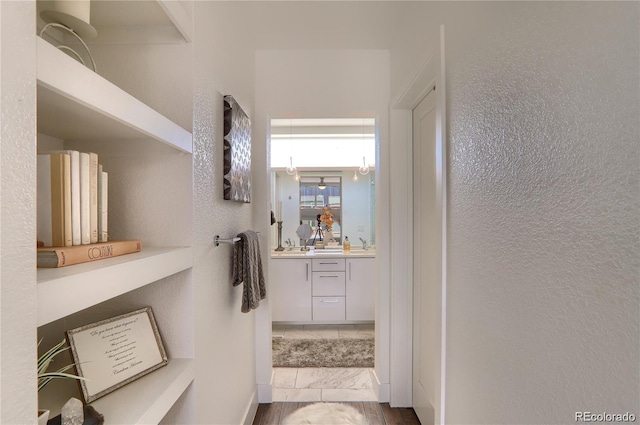3030 Wilson Ct Unit 5, Denver, CO 80205 - bathroom featuring vanity and a textured wall
