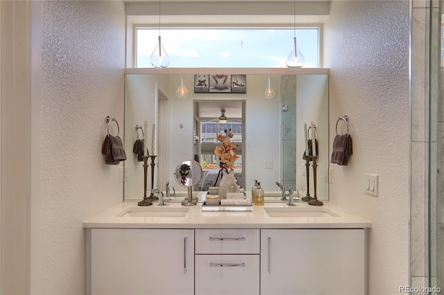 3030 Wilson Ct Unit 5, Denver, CO 80205 - bathroom featuring a textured wall and double vanity
