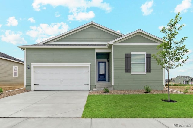 2171 Christina St, Fort Lupton, CO 80621 - view of front of property with a front lawn, driveway, and an attached garage