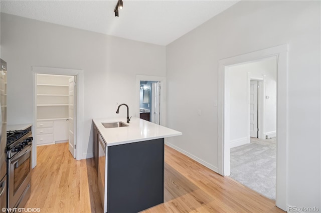 3817 Osage St, Denver, CO 80211 - kitchen with gas stove, light wood finished floors, and light countertops