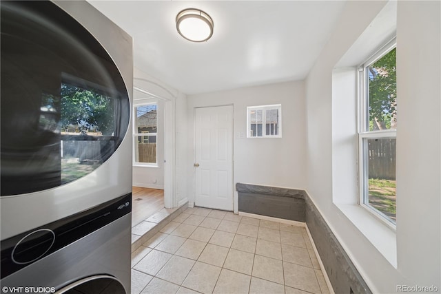 3817 Osage St, Denver, CO 80211 - foyer entrance with stacked washing machine and dryer and light tile patterned floors