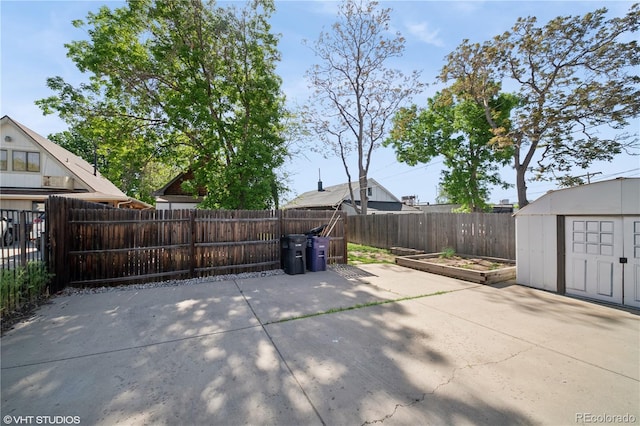 3817 Osage St, Denver, CO 80211 - fenced backyard with a patio, a storage shed, and a garden