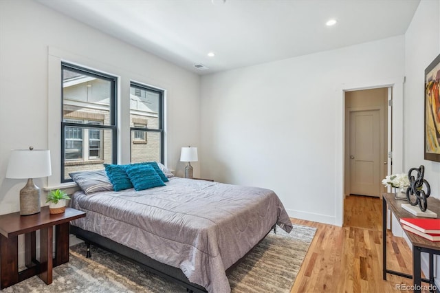 bedroom with light hardwood / wood-style floors