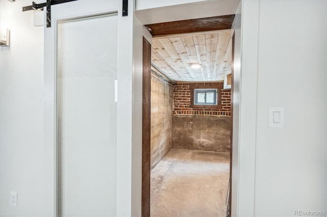 bathroom featuring brick wall