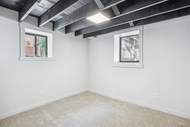 basement featuring carpet floors and wooden ceiling