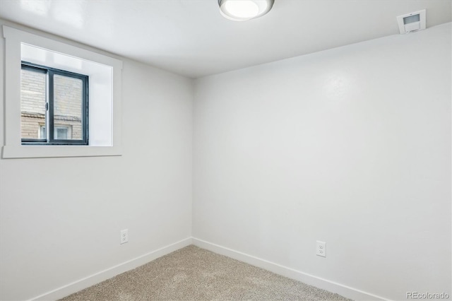 spare room featuring carpet flooring