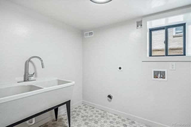 washroom featuring hookup for an electric dryer, washer hookup, and sink