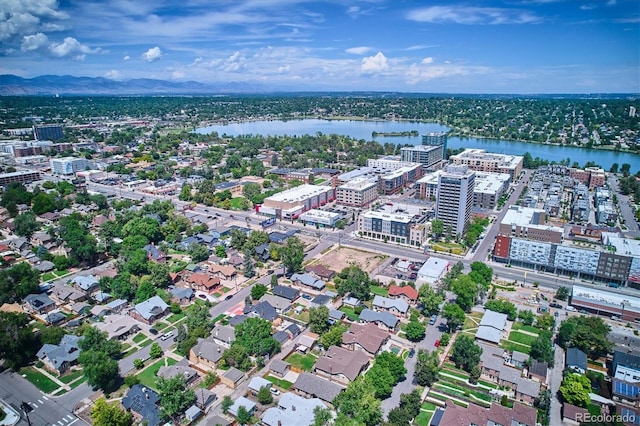 drone / aerial view featuring a water and mountain view