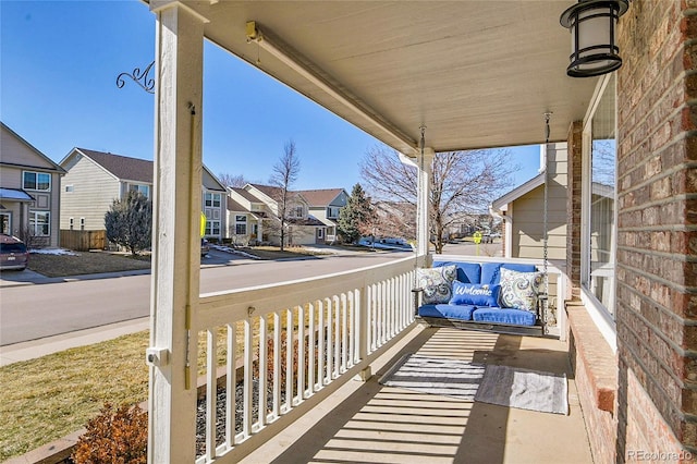 balcony with a residential view and covered porch