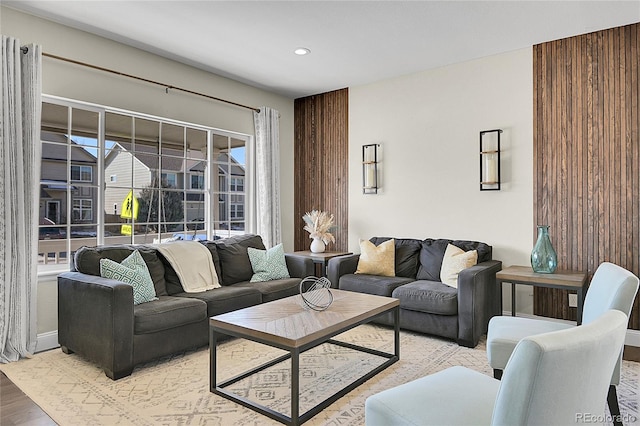 living room featuring light wood finished floors and recessed lighting