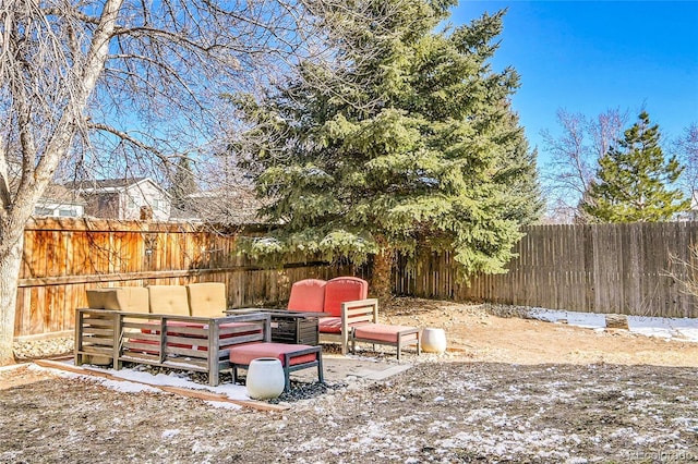 view of yard with outdoor lounge area and a fenced backyard