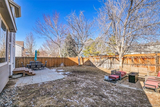 view of yard featuring an outdoor hangout area, a patio, and a fenced backyard