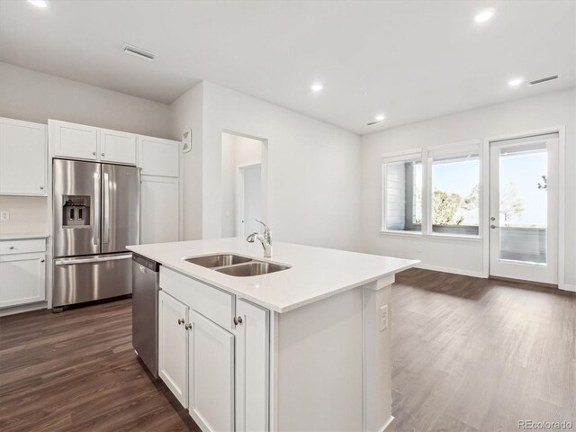 485 Interlocken Blvd Unit 101, Broomfield, CO 80021 - kitchen featuring stainless steel appliances, dark wood-style flooring, white cabinets, light countertops, and recessed lighting