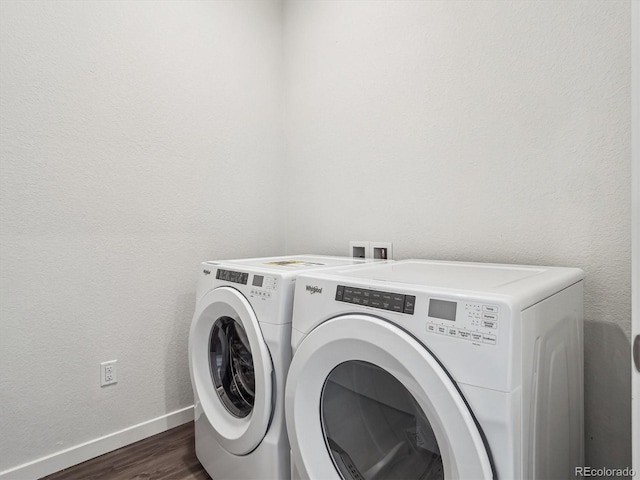 485 Interlocken Blvd Unit 101, Broomfield, CO 80021 - laundry room with washer and clothes dryer and dark wood-type flooring