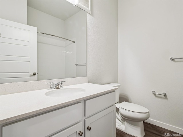 485 Interlocken Blvd Unit 101, Broomfield, CO 80021 - bathroom featuring wood finished floors, vanity, and a shower