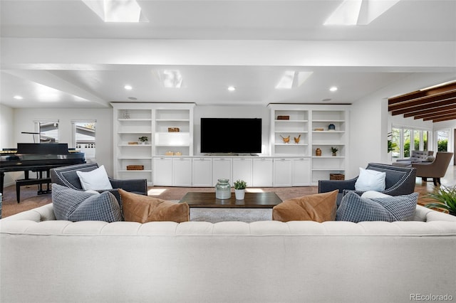 living area with recessed lighting and a skylight