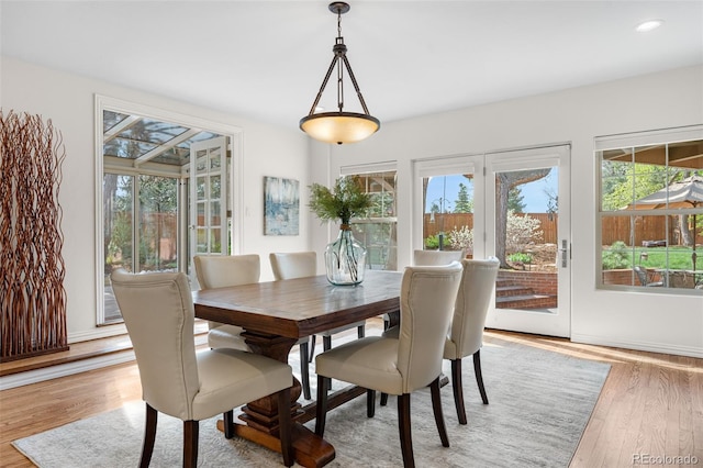 dining area featuring light wood-type flooring