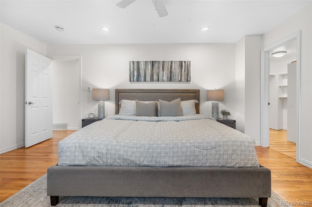 bedroom with baseboards, recessed lighting, light wood finished floors, and ceiling fan