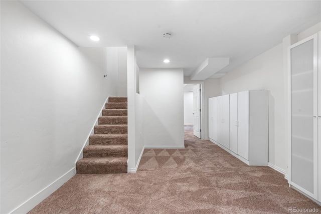 finished basement with recessed lighting, carpet floors, baseboards, and stairs