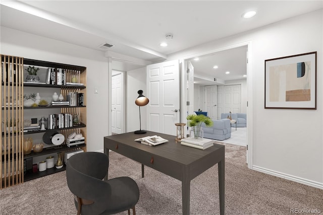 carpeted office space featuring recessed lighting, baseboards, and visible vents