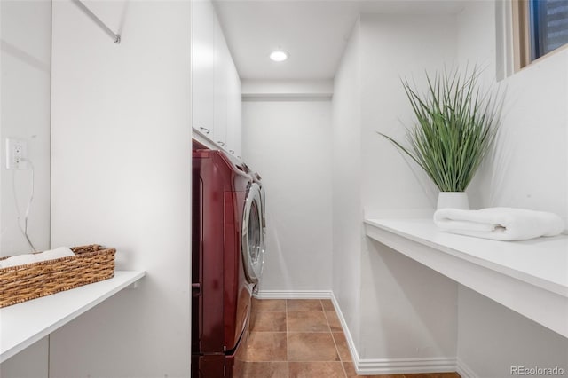 laundry room featuring baseboards, recessed lighting, cabinet space, and washer and clothes dryer