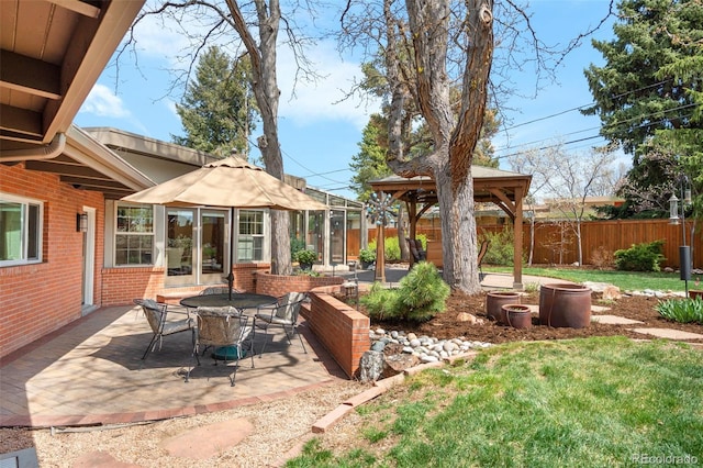 view of patio / terrace with a gazebo and a fenced backyard