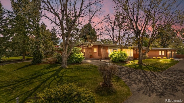 5471 S Sherman St, Littleton, CO 80121 - view of front of home featuring asphalt driveway and a lawn