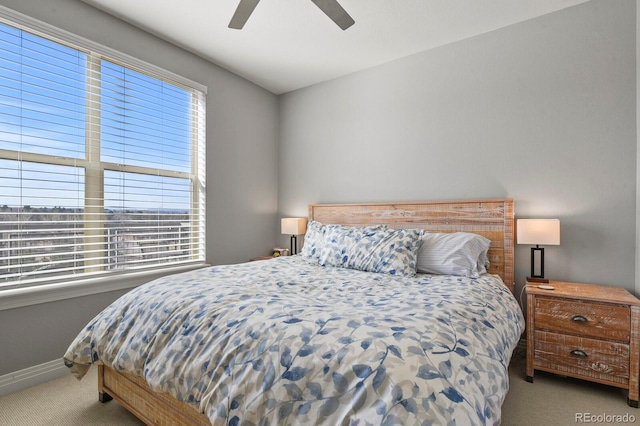 bedroom featuring carpet flooring, ceiling fan, and baseboards