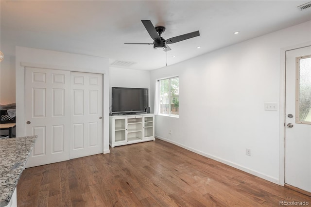 3629 W Custer Pl, Denver, CO 80219 - unfurnished living room with a ceiling fan, wood finished floors, baseboards, and recessed lighting
