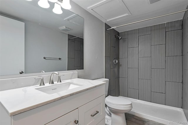 bathroom with vanity, toilet, and hardwood / wood-style floors