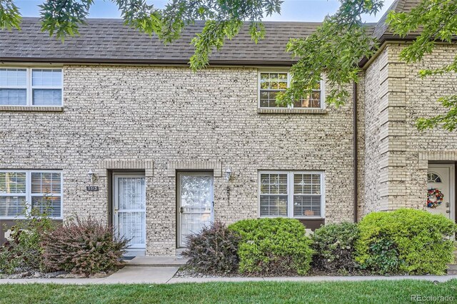 5511 S Lowell Blvd, Littleton, CO 80123 - view of front of home with brick siding and a shingled roof