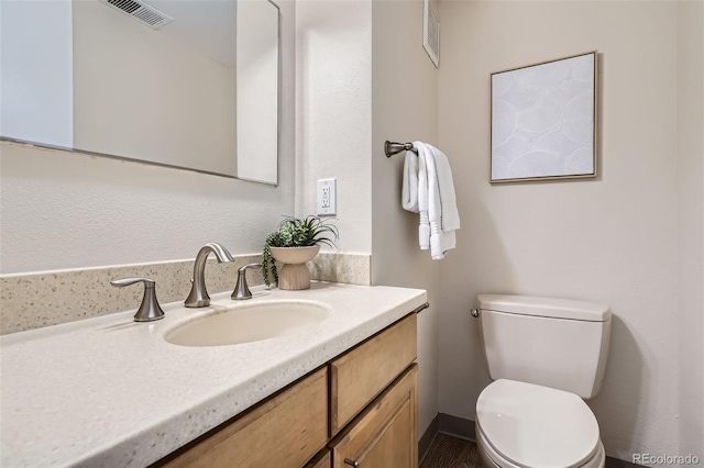 5511 S Lowell Blvd, Littleton, CO 80123 - bathroom featuring vanity and toilet