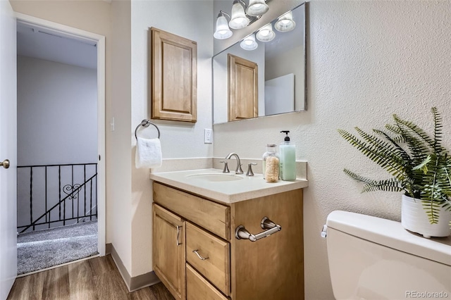 5511 S Lowell Blvd, Littleton, CO 80123 - half bath featuring wood finished floors and vanity