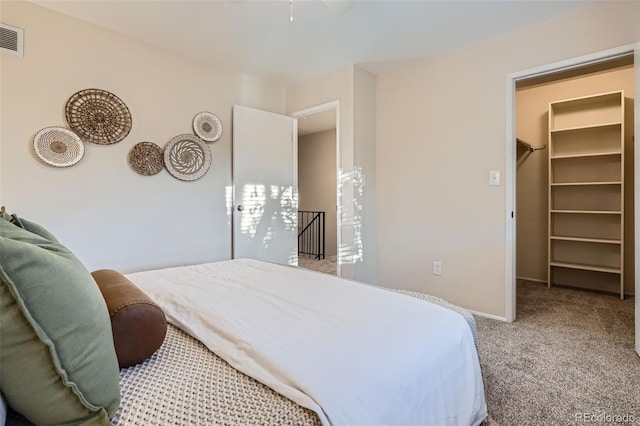 5511 S Lowell Blvd, Littleton, CO 80123 - carpeted bedroom featuring a walk in closet and baseboards