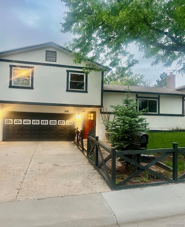 1676 S Fairplay St, Aurora, CO 80012 - view of front of home with a garage and concrete driveway