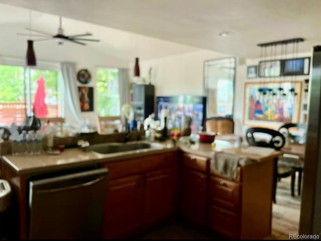 1676 S Fairplay St, Aurora, CO 80012 - kitchen featuring stainless steel dishwasher, ceiling fan, healthy amount of natural light, a sink, and lofted ceiling