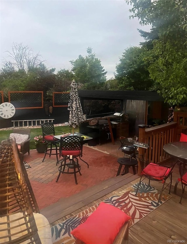 1676 S Fairplay St, Aurora, CO 80012 - wooden deck featuring outdoor dining space and a fenced backyard