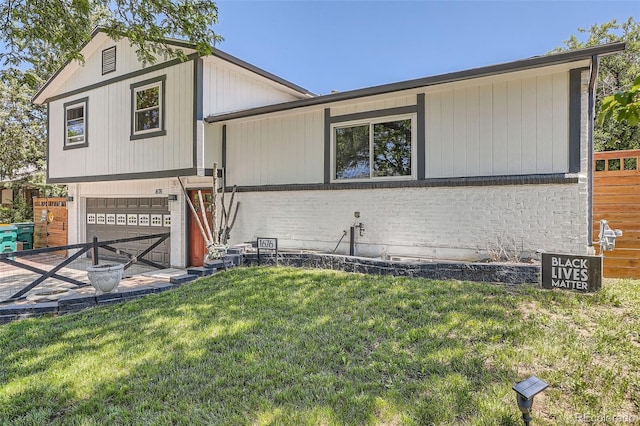 1676 S Fairplay St, Aurora, CO 80012 - view of front of house featuring a front lawn and an attached garage