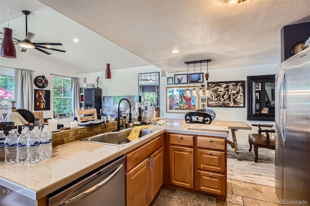 1676 S Fairplay St, Aurora, CO 80012 - kitchen with appliances with stainless steel finishes, a sink, open floor plan, a ceiling fan, and recessed lighting