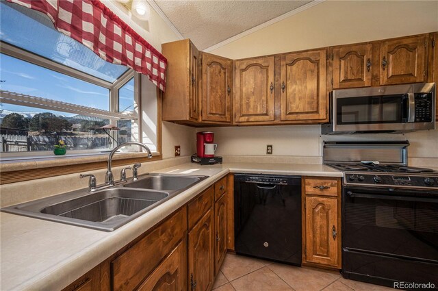 kitchen with black appliances, sink, vaulted ceiling, light tile patterned floors, and a textured ceiling