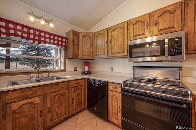 kitchen featuring light tile patterned flooring, sink, lofted ceiling, ornamental molding, and black appliances