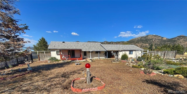 exterior space with a porch and a mountain view