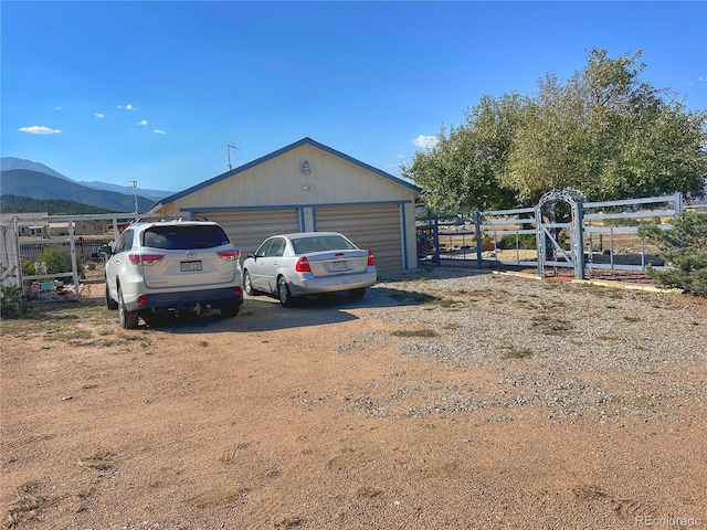 13440 County Rd 45, Coaldale, CO 81222 - view of side of property featuring a garage and a mountain view
