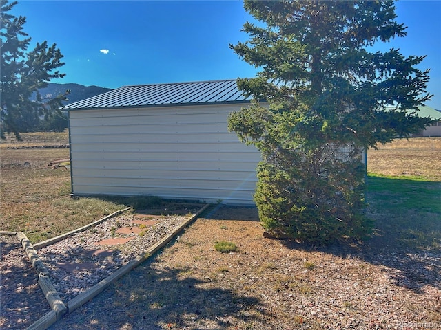 view of side of home with a mountain view