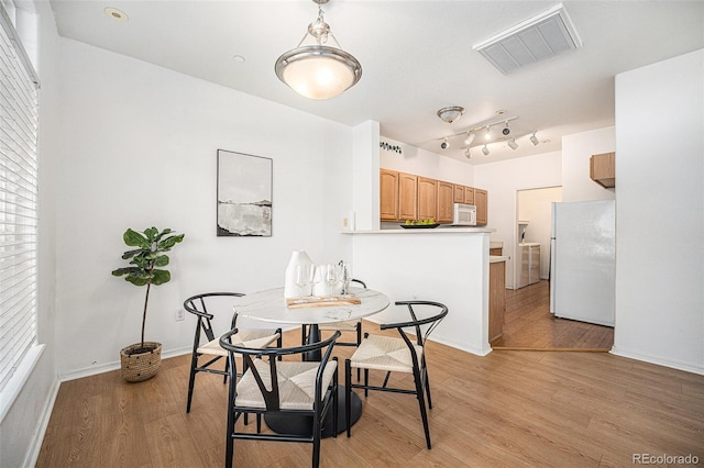 dining area featuring light hardwood / wood-style floors