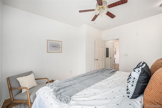 bedroom with ceiling fan and electric panel