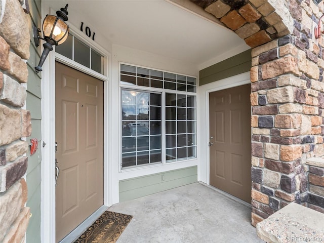 view of exterior entry featuring stone siding
