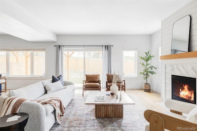 108 Arapahoe St, Golden, CO 80403 - living room with wood finished floors, a high end fireplace, and baseboards