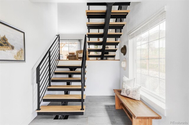 108 Arapahoe St, Golden, CO 80403 - stairs with a high ceiling, baseboards, and wood finished floors